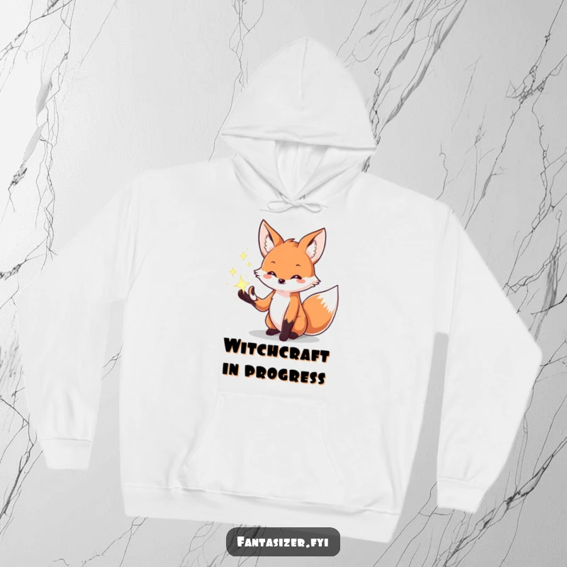 Funny hoodie with a creative fox character conjuring glowing, sparkling magical effects from its paws, embodying mystical power.