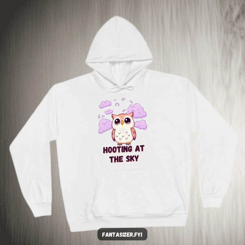 Funny hoodie featuring a cute owl with wide eyes gazing at a mesmerizing sky of swirling purple clouds, providing warmth and a touch of enchantment.