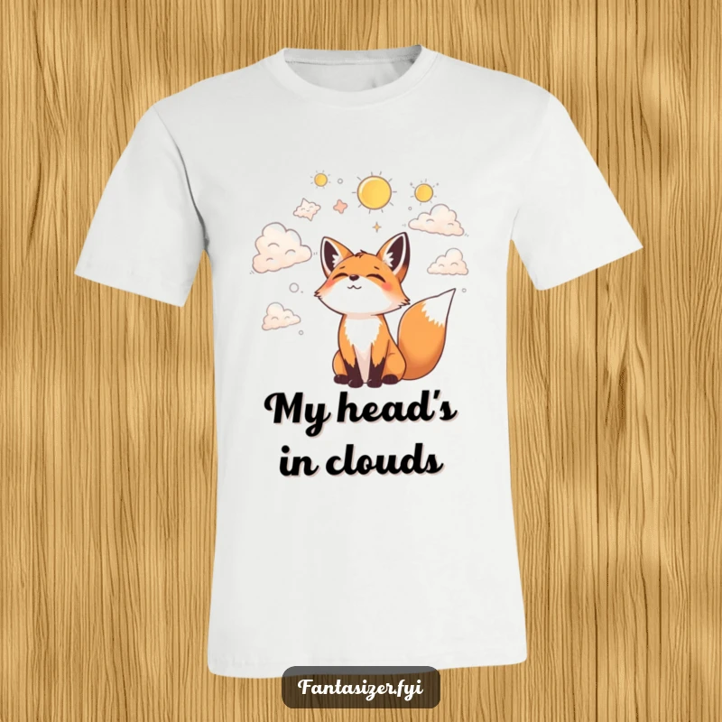 Funny T-shirt featuring a joyful fox looking up at the clouds, happily envisioning fantastical shapes and mythical beings.